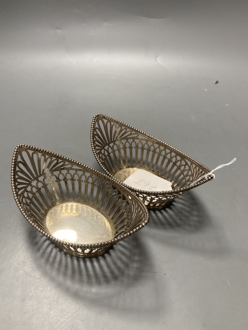 A pair of early 20th century Dutch pierced 833 standard white metal boat shaped bonbon dishes, 14.1cm, 7 oz.